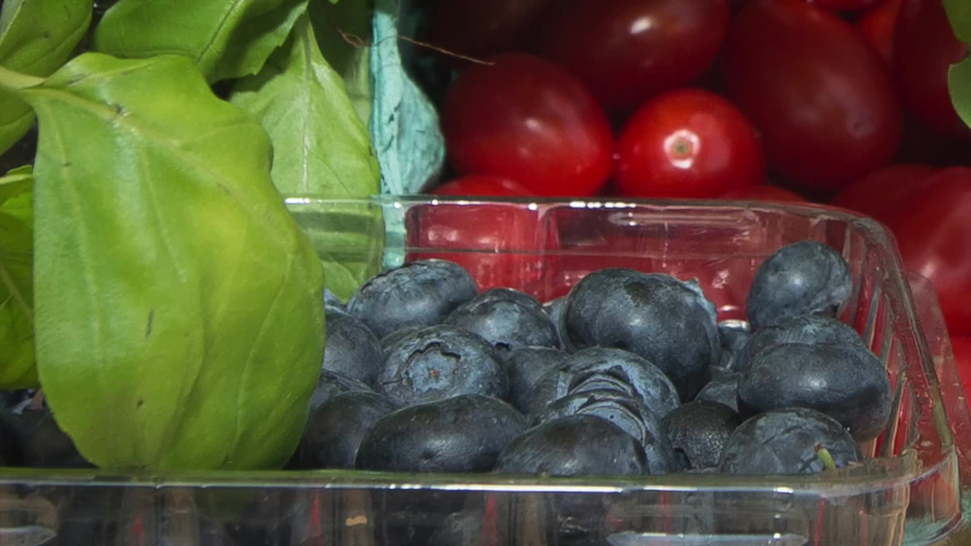 Fresh basil, cherry tomatoes and blueberries